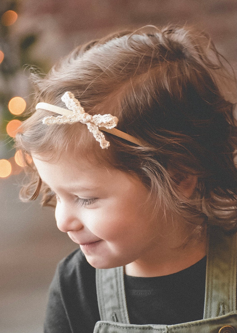 macrame lace bow baby and toddler sized headband 