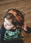 toddler sized knot headband for kids in burnt orange color